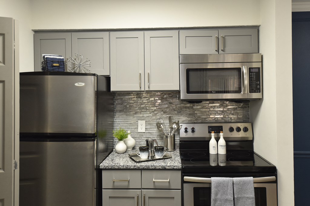 Upgraded kitchen with stainless steel appliances in Nashville apartment