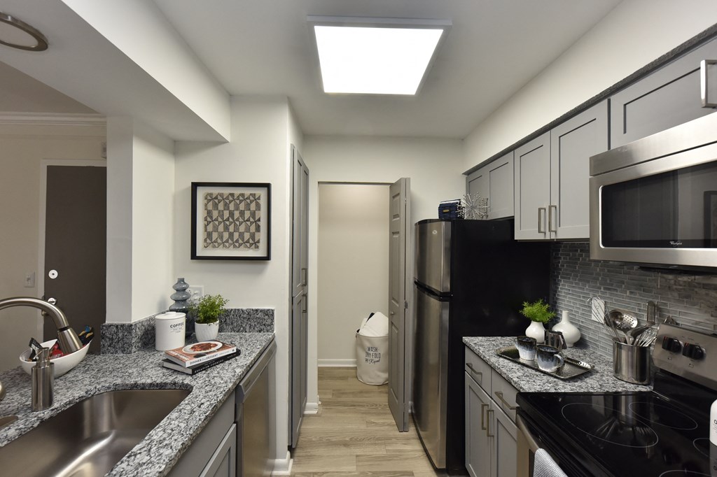 Upgraded kitchen with stainless steel appliances in Nashville apartment