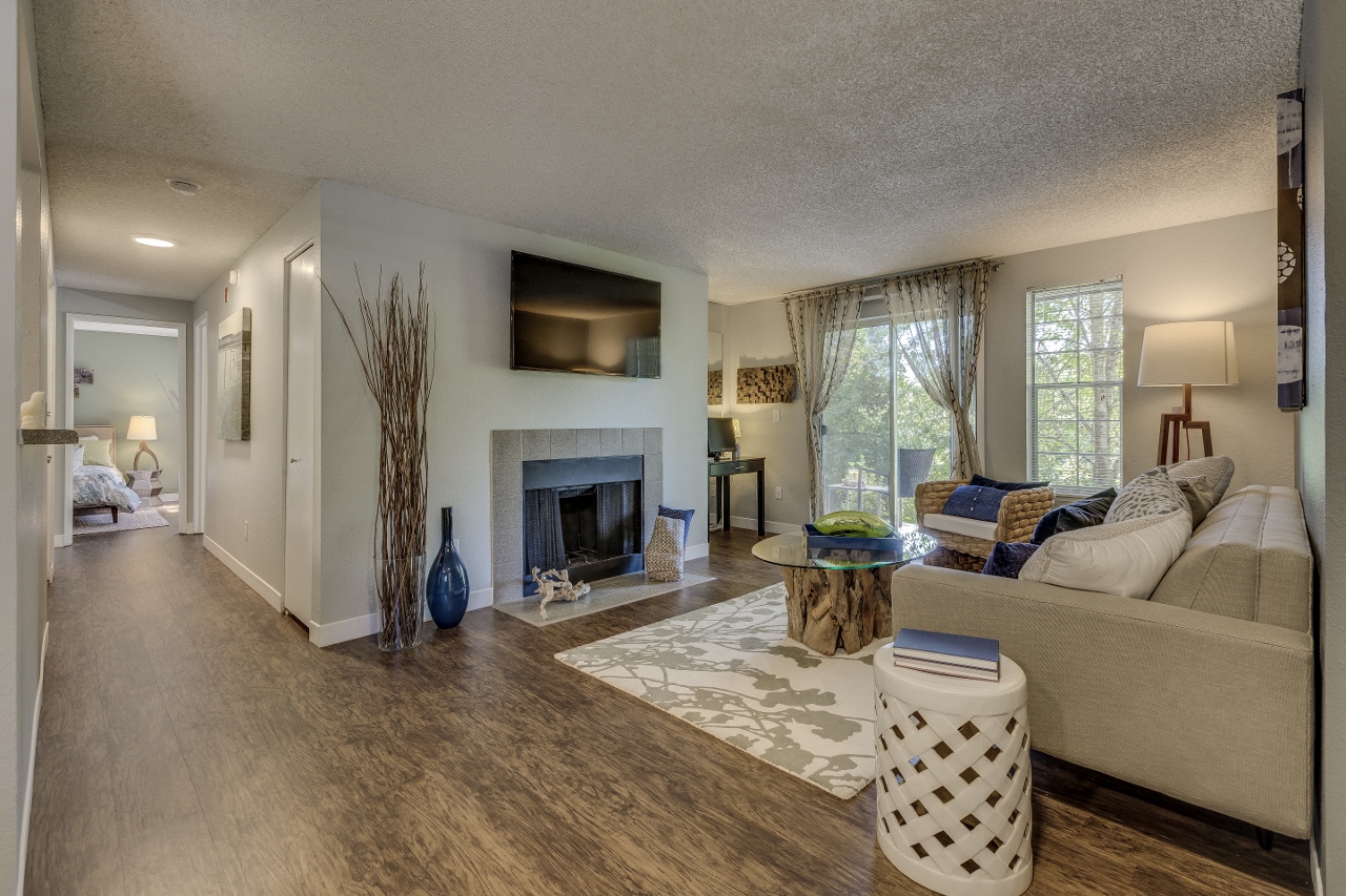 a living room with a couch and a fireplace