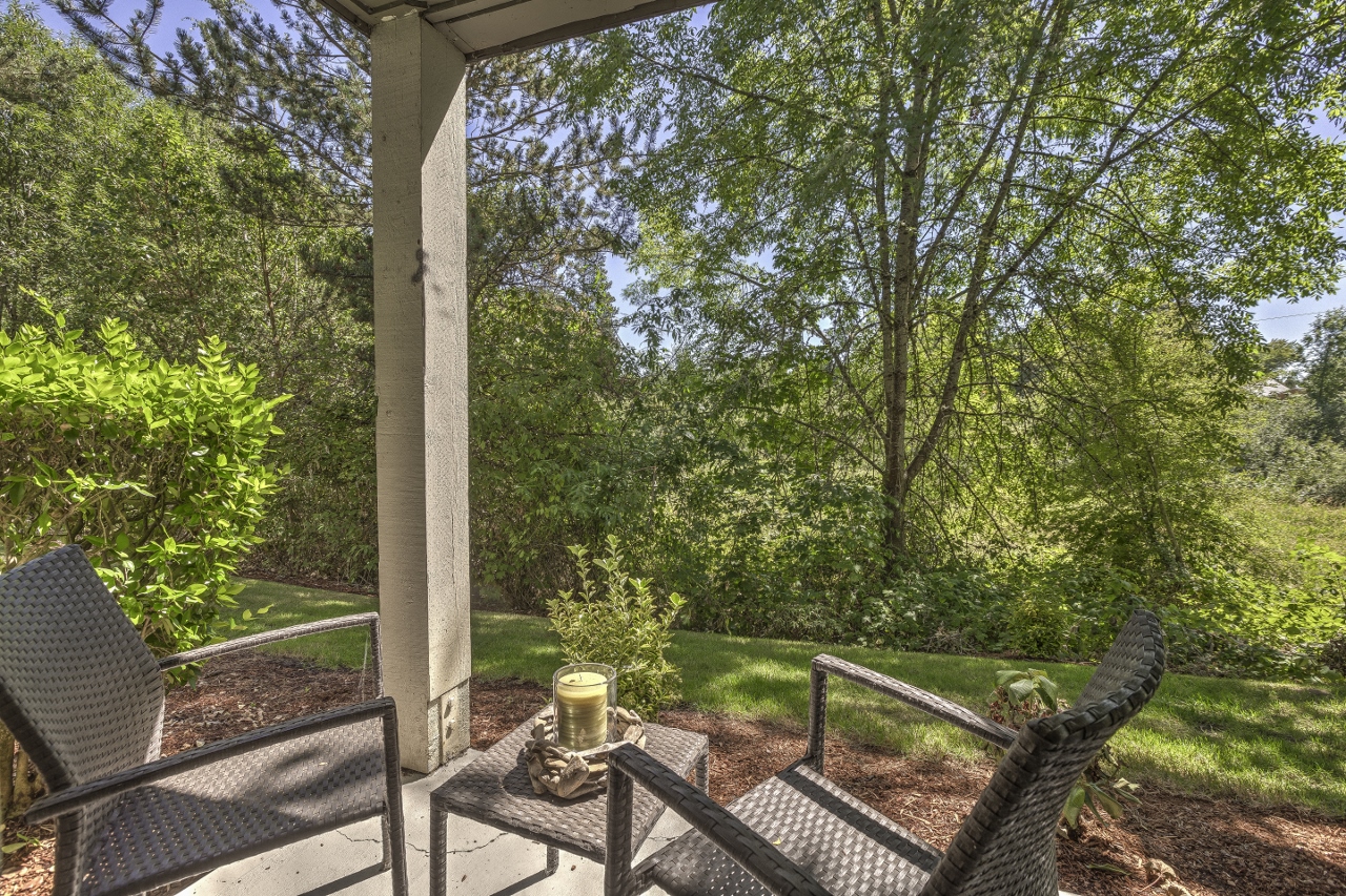 2-BR Apartments in Beaverton, OR - Cedar Crest Apartments - Outdoor Patio with View of Green Grass and Lush Trees