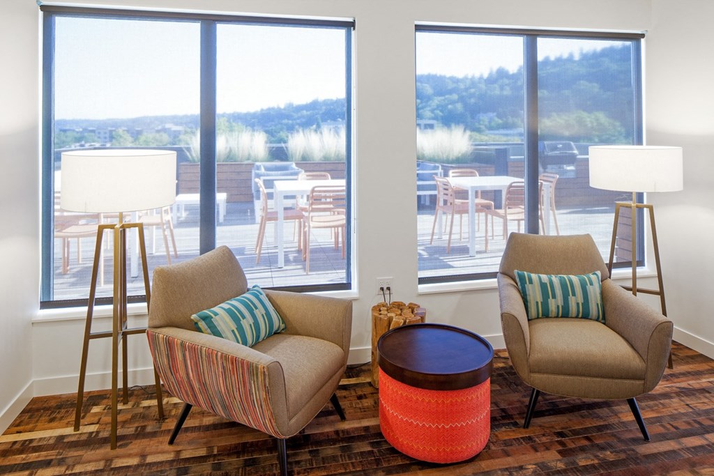 a living room with two chairs and a table