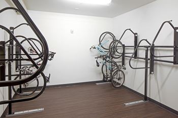 a wall mounted bike rack with several bikes on it