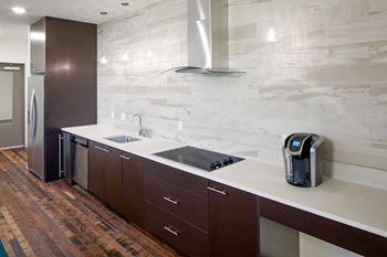 a kitchen with a sink and a stove