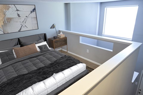 Greentree Apartments in Savannah, GA photo of a bedroom with a bed and a ledge with a window