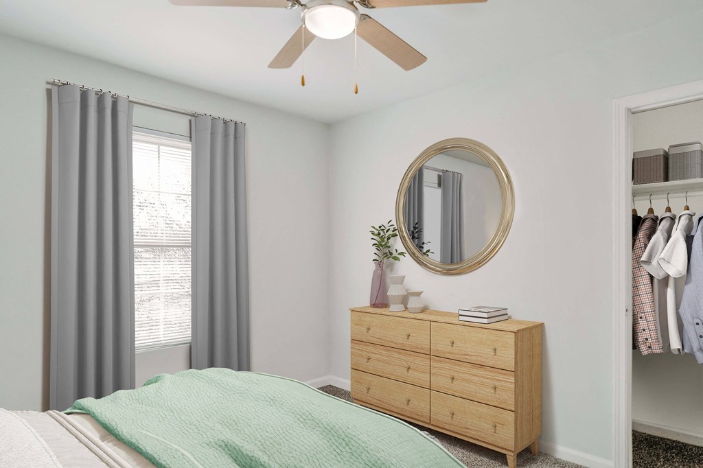 a bedroom with a bed and a ceiling fan