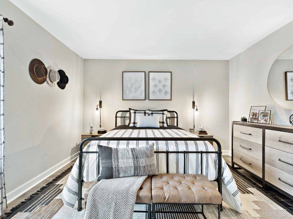 a bedroom with a bed and a dresser