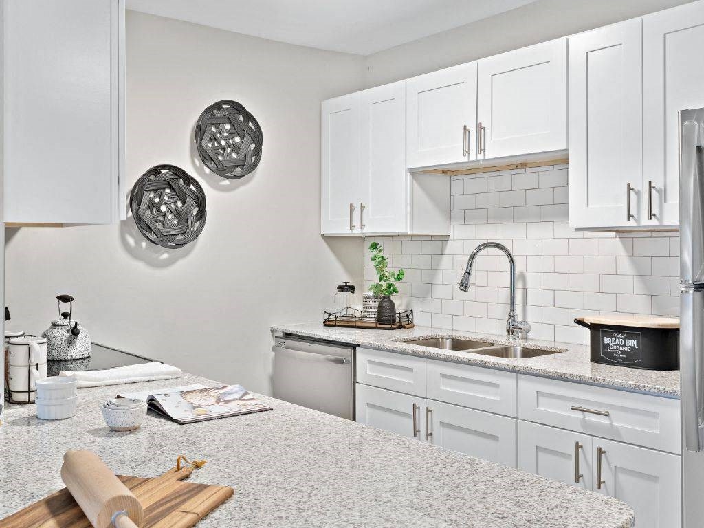 a kitchen with a large counter top and a sink