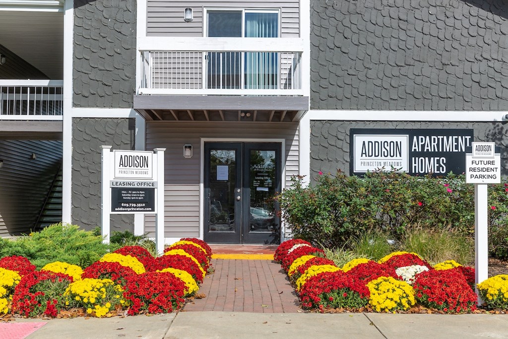 a picture of the front of the addison apartments