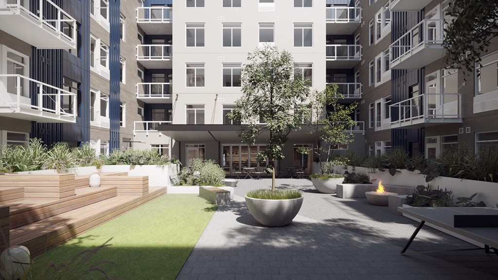 Luxury Studio Apartments in Vancouver, WA - Adera - Courtyard with Beautiful Landscaping, High-End Finishes, Various Seating Options, a Firepit, and a Ping Pong Table