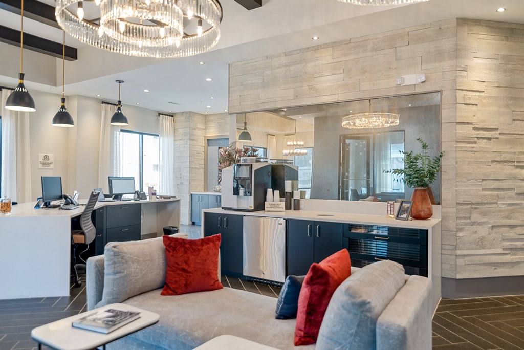 a living room with a kitchen and a couch