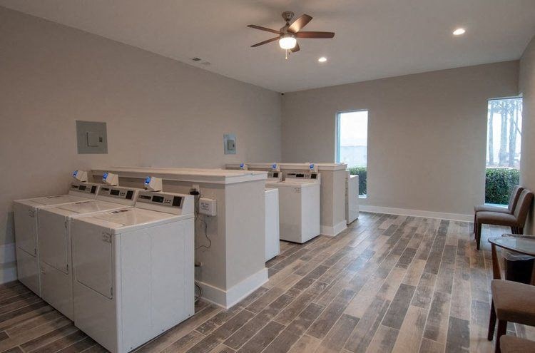 a group of washes in a room with a ceiling fan
