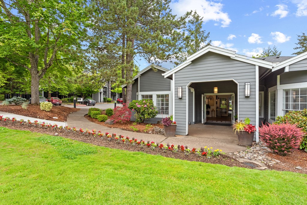 A house with a grey roof and a garden in front. at Cedar Crest, Beaverton