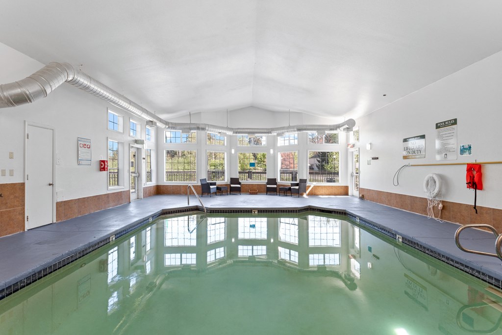A large indoor swimming pool with a glass bottom. at Cedar Crest, Beaverton, 97078