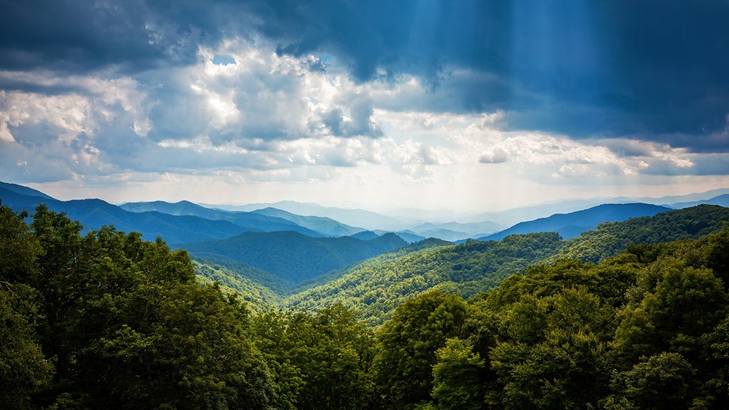 a view of the smoky mountains under a cloudy sky