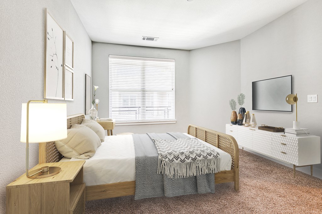 a bedroom with a bed and a tv