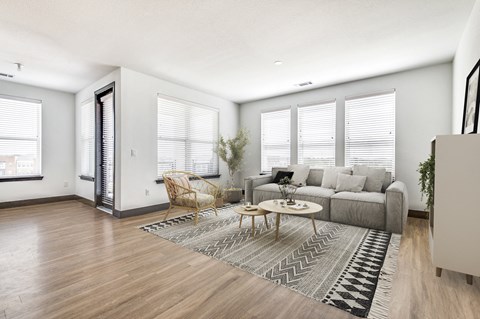 an open living room with a couch and a coffee table