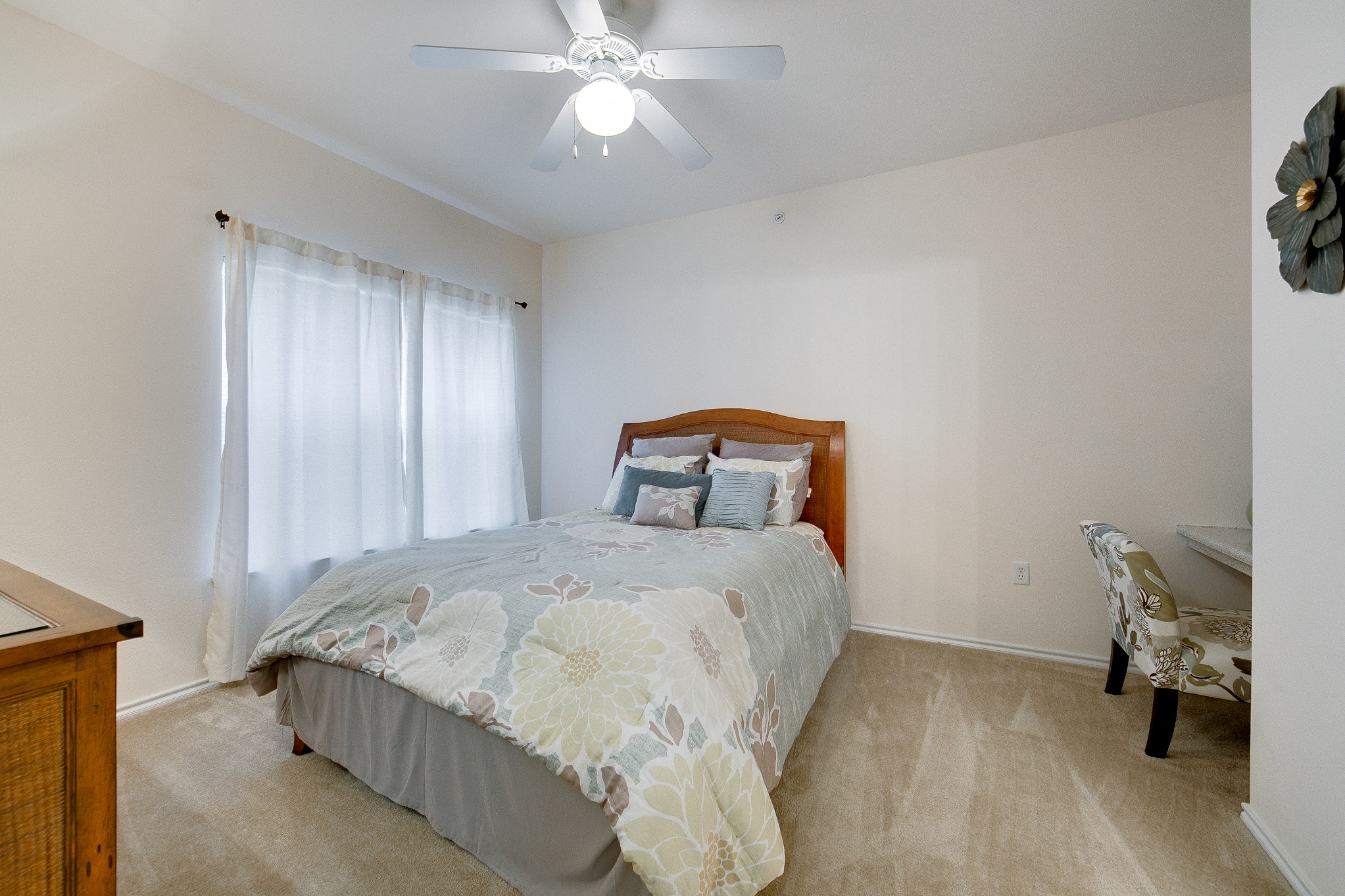 Three-Bedroom Apartments in Grand Prairie, TX - Forum at Grand Prairie - Bedroom with Ceiling Fan, Wall-to-Wall Carpeting, and Built-In Computer Niche