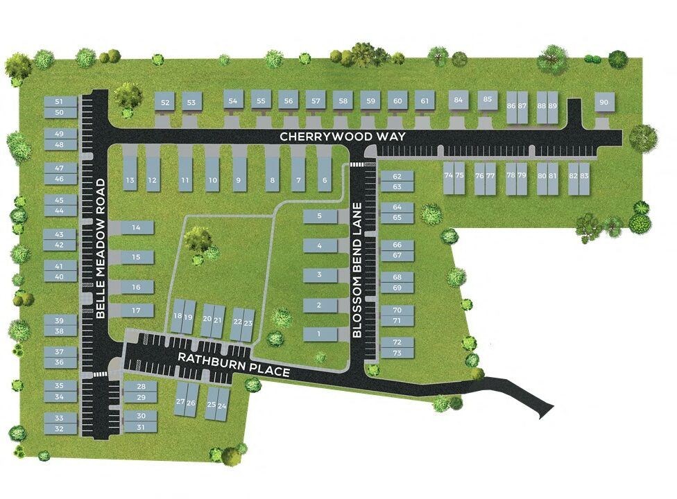 an aerial view of an apartment complex with buildings and grass