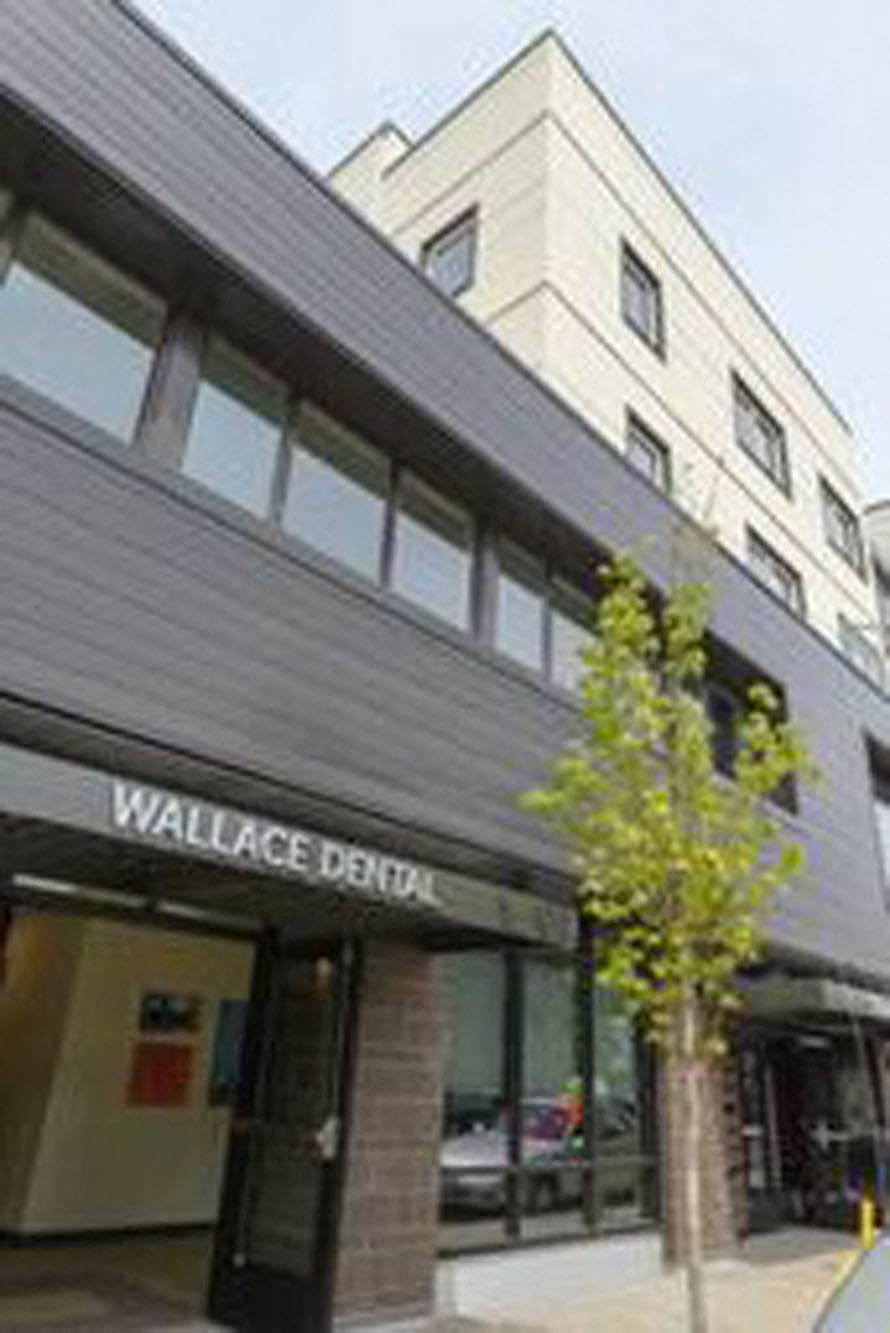 a building with a wallace bank on the street