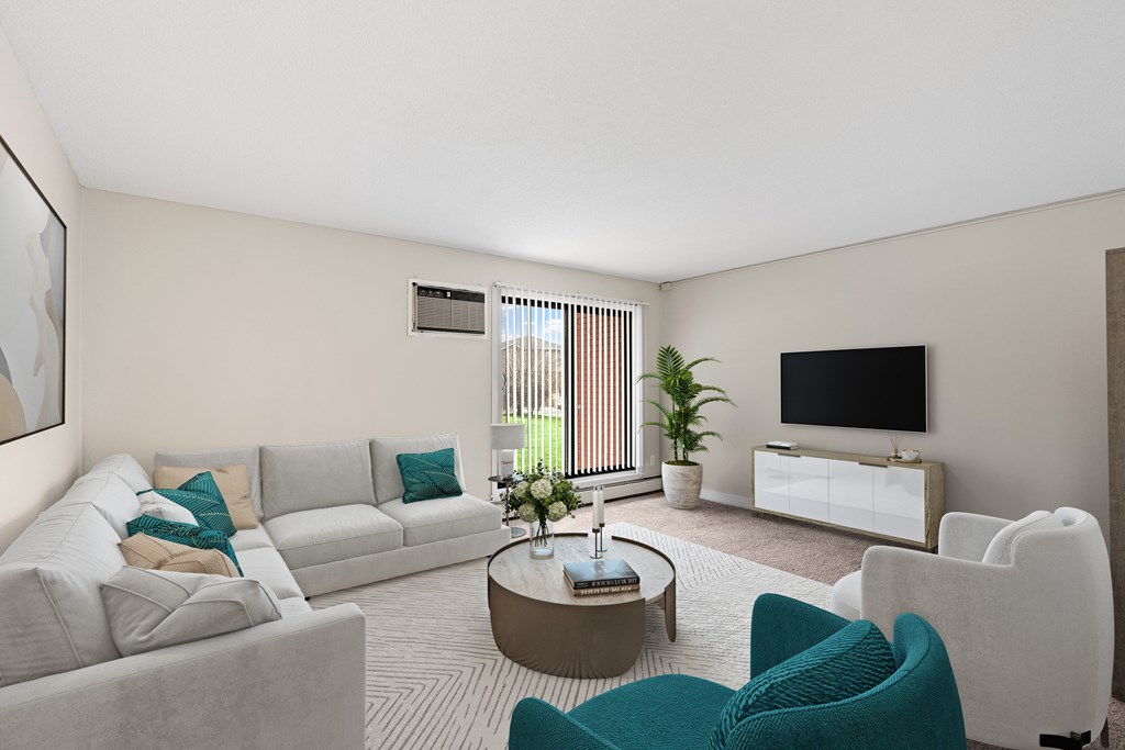 A living room with a grey sofa, a white armchair, and a coffee table.