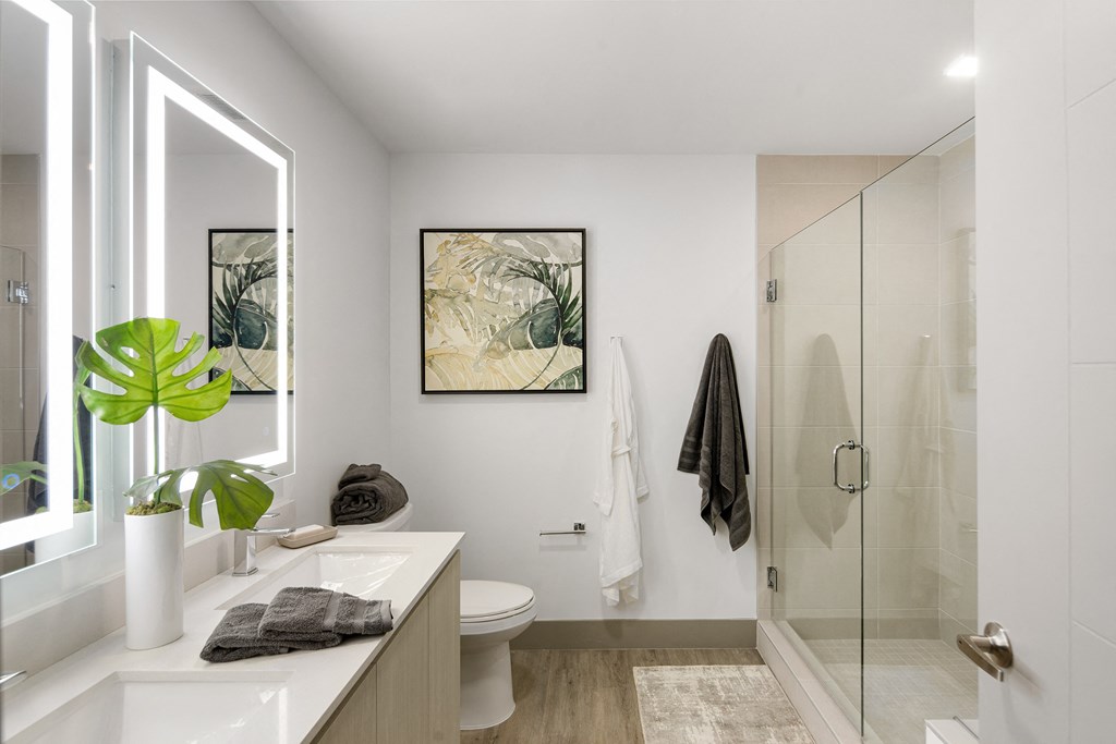 Luxury Boca Raton Apartments – CERU - a bathroom with a shower and a sink and a mirror