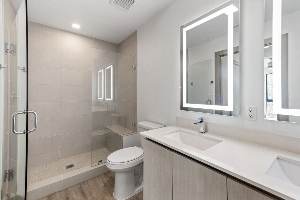 Pet-Friendly Apartments in Boca Raton, FL – CERU - a luxury bathroom with a sink toilet and a shower