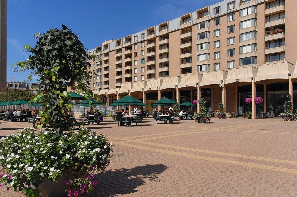A large building with a courtyard in front of it.