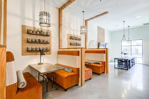 A modern dining area with a table and chairs.