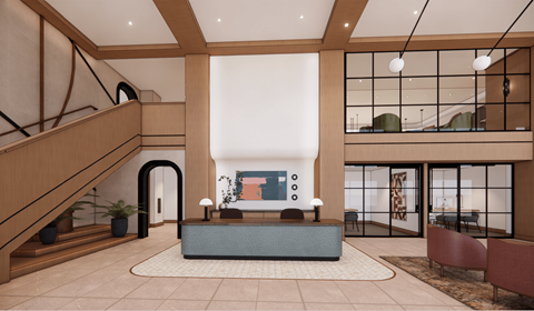 A modern living room with a staircase on the left and a sofa set in the center.