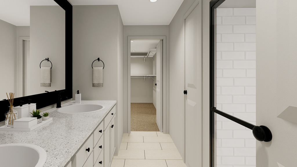 a white bathroom with two sinks and a shower