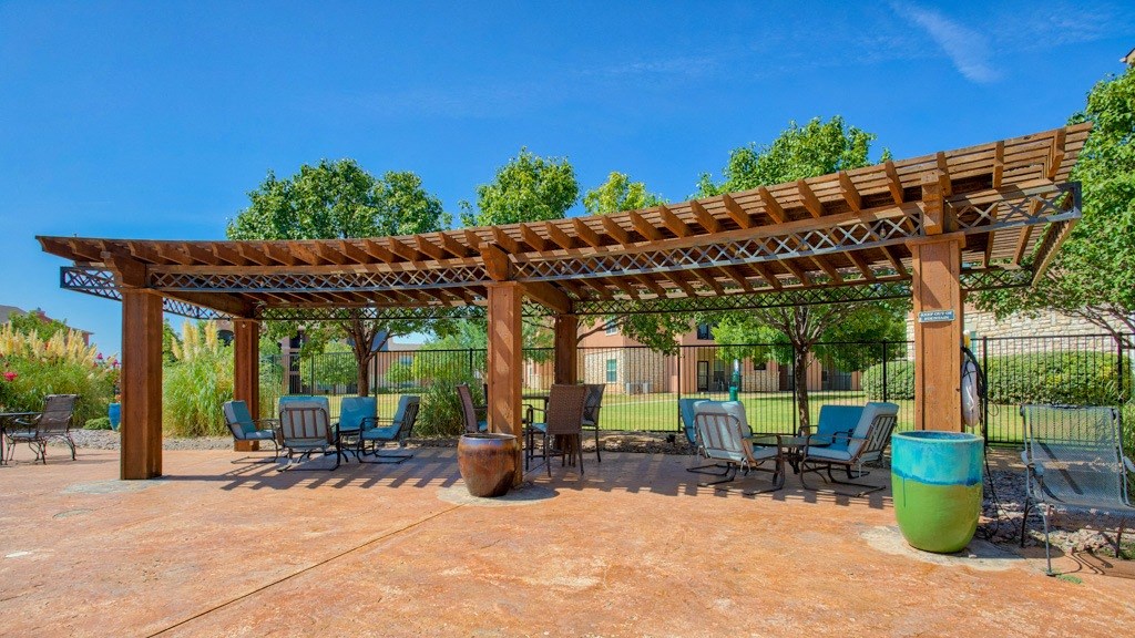 Resort Style Swimming Pool with Cabana and picnic area with tables and chairs