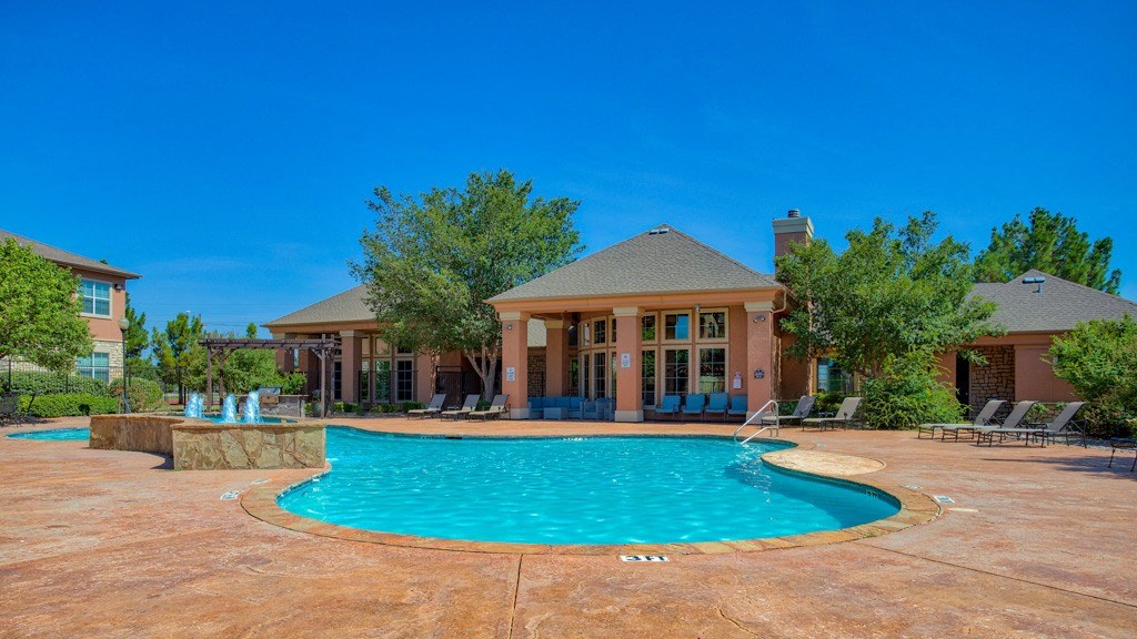 Resort Style Swimming Pool with  beach chairs surrounding