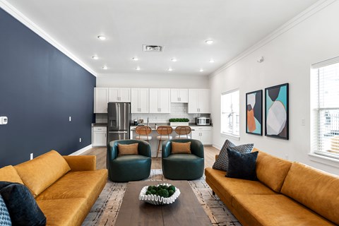 A modern living room with a yellow sofa and a wooden coffee table.
