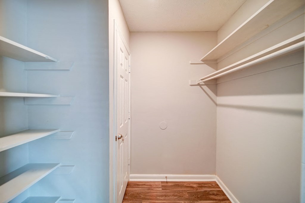 a walk in closet in a 555 waverly unit