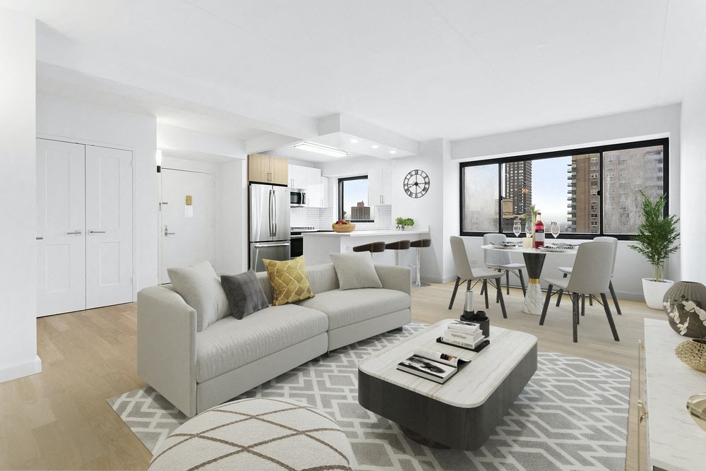 a living room and dining room with a couch and a table