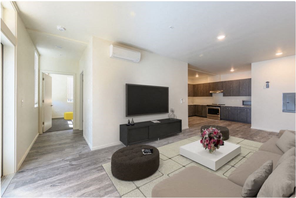 a living room filled with furniture and a flat screen tv