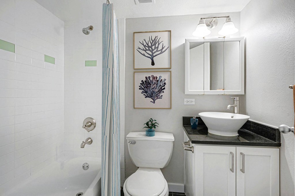 a small bathroom with a toilet sink and shower