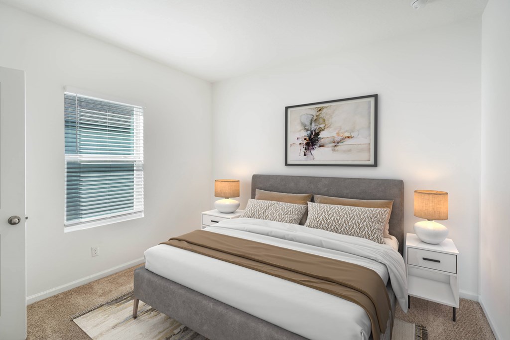 A bedroom with a bed, nightstands, and a painting on the wall.