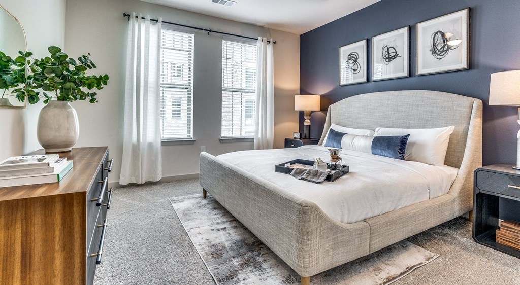 a bedroom with a bed and a dresser