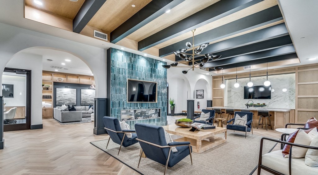 a living room with a table and chairs and a television