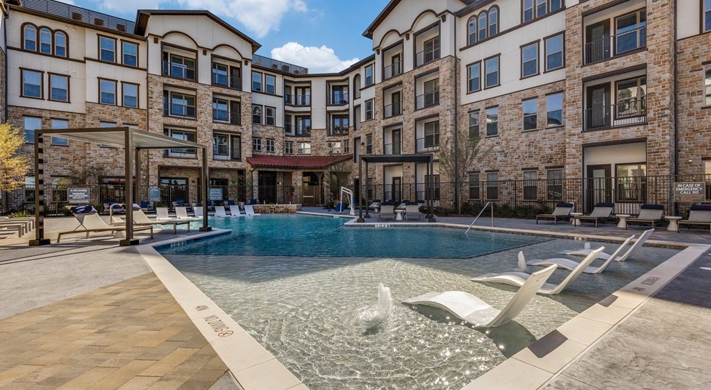 a swimming pool in the middle of an apartment building