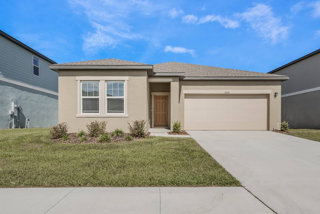 A house with a brown garage door and a brown front door.