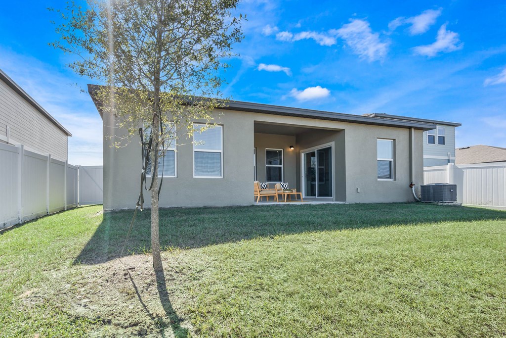 A house with a tree in front of it.