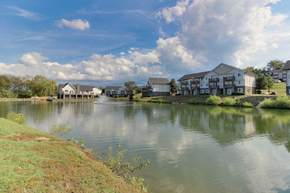 a body of water with houses on the side of it