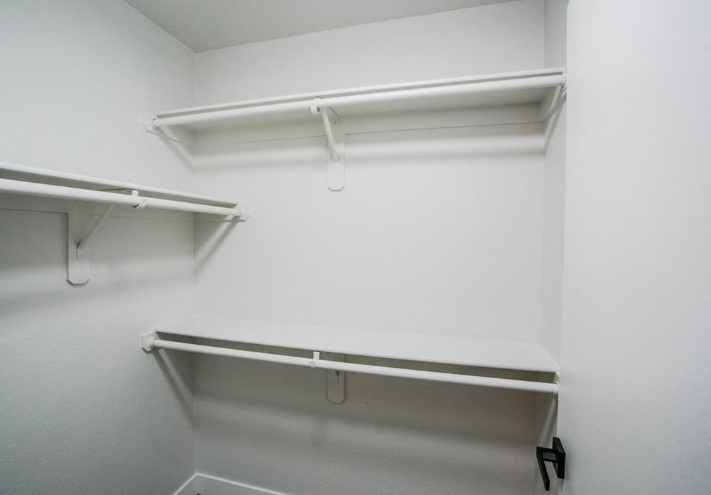 a walk in closet in a 555 waverly unit
