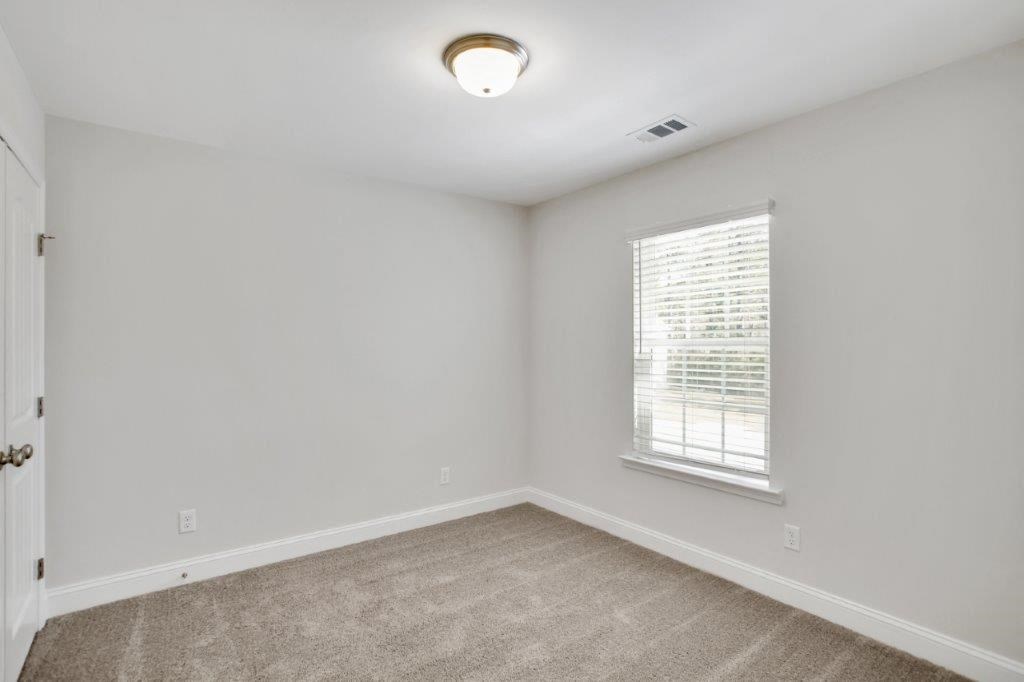 Harris Trail Luxury Townhomes for rent Richmond Hill, GA photo of bedroom with plush carpeting