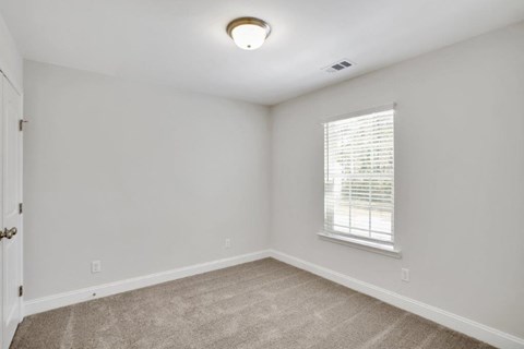 Harris Trail Luxury Townhomes for rent Richmond Hill, GA photo of bedroom with plush carpeting
