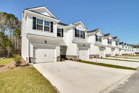 Harris Trail Luxury Townhomes for rent Richmond Hill, GA photo of townhomes with garages and driveways