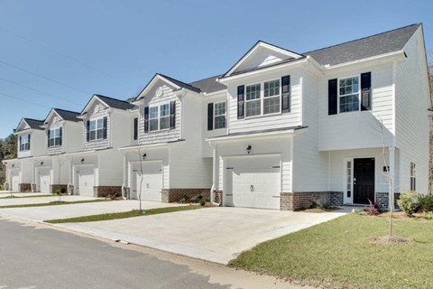Harris Trail Luxury Townhomes for rent Richmond Hill, GA photo of townhomes with garages and driveways