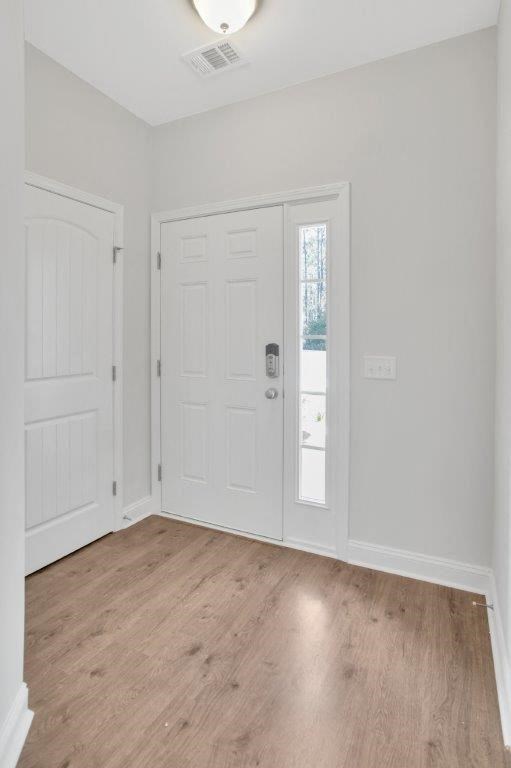 Harris Trail Luxury Townhomes for rent Richmond Hill, GA photo of entry with smart lock